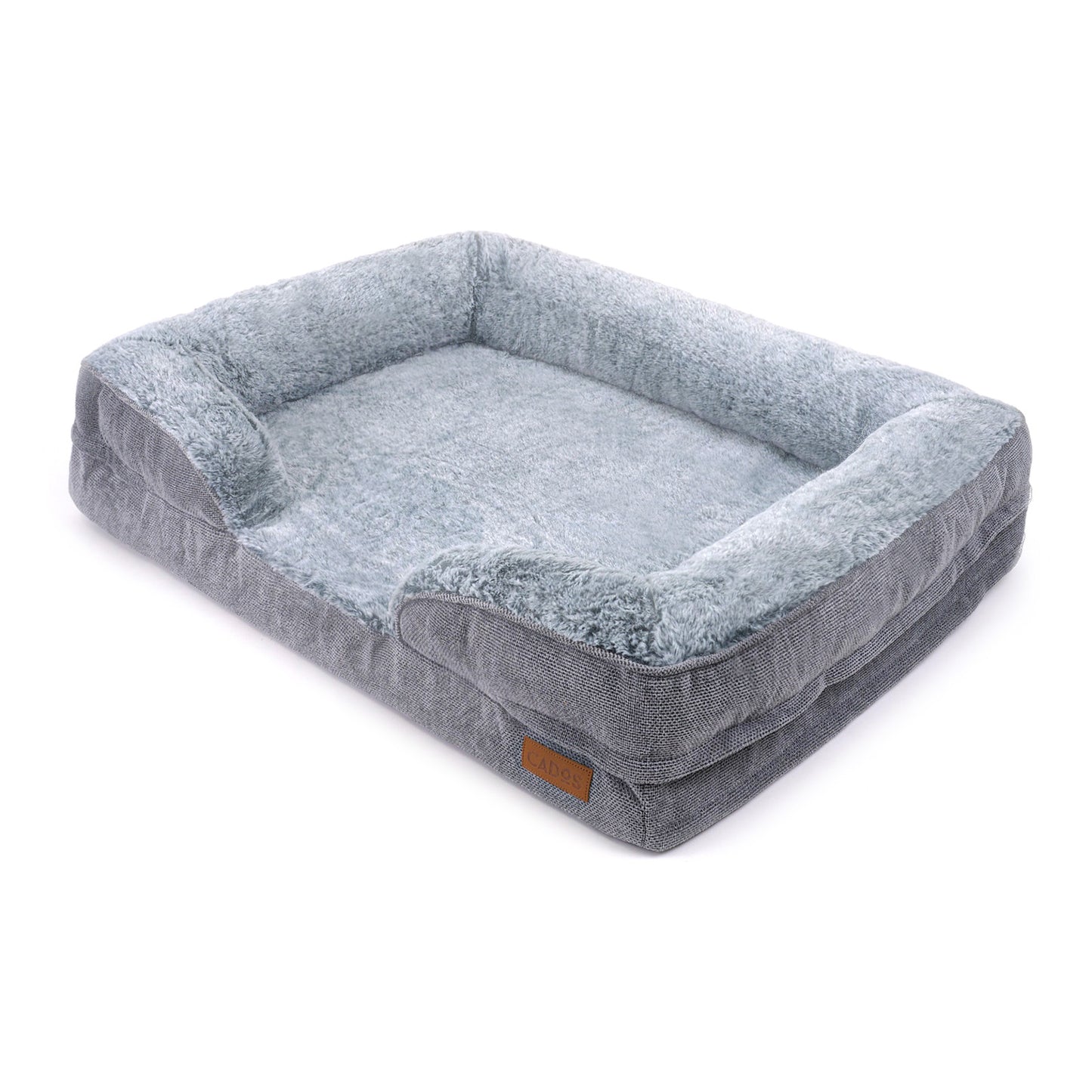 A plush orthopedic support mattress bed for dogs, made of memory foam and covered in grey fabric, with a soft faux fur top. Side View